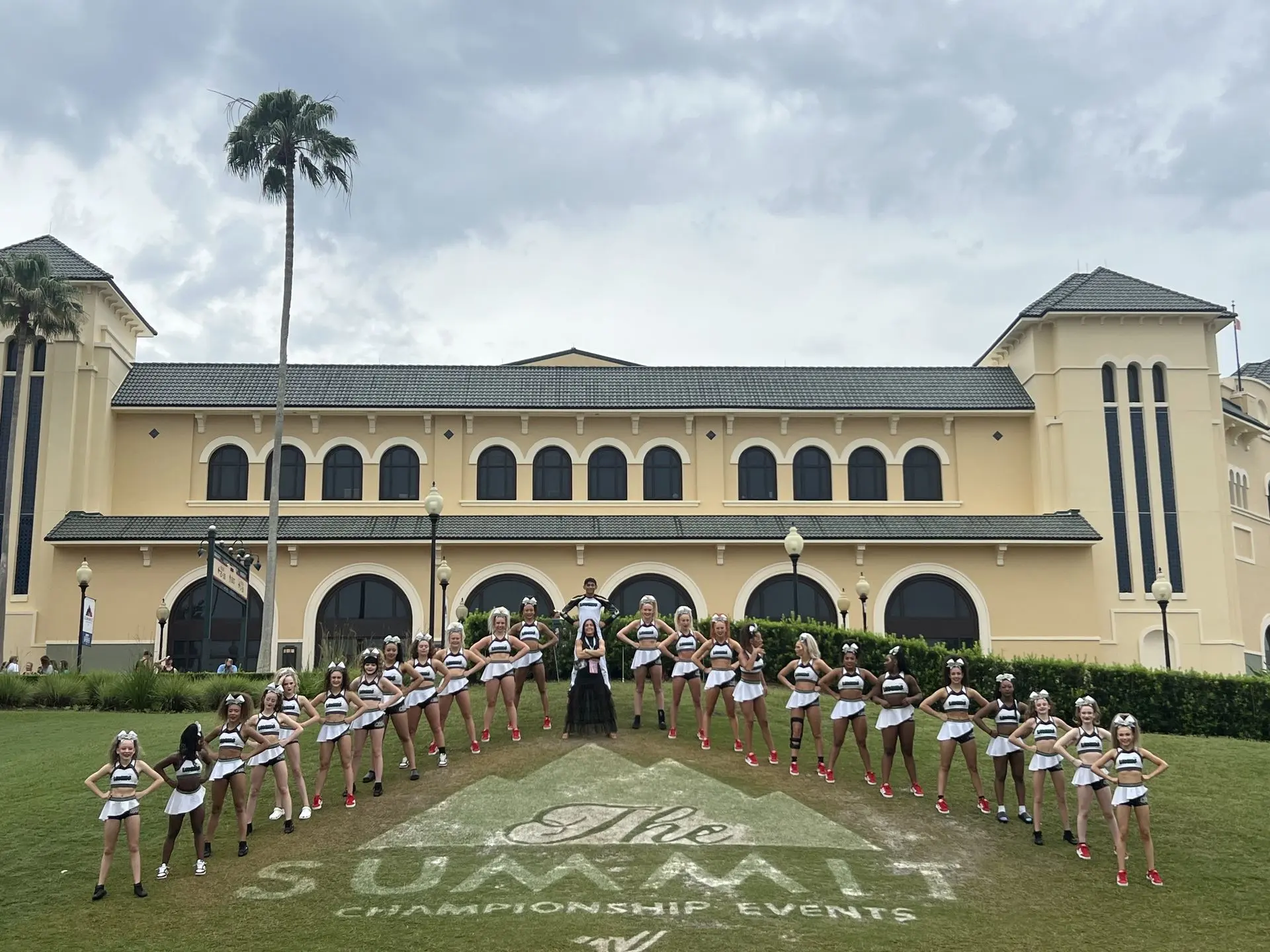 cheerleading team at the summit with the espn wide world of sports stadium in the background